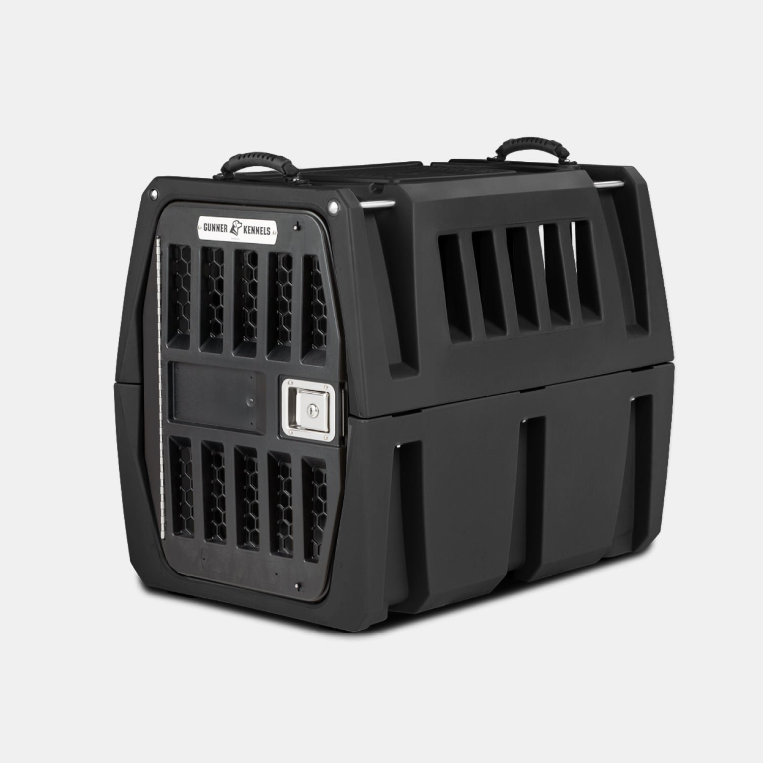 The GUNNER G1™ KENNEL - BLACK is a tough dog crate with sturdy black plastic, a metal mesh door, side ventilation slats, top carrying handles, a secure latch, and reinforced design—ideal for safe pet travel or transport.