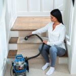 BISSELL Little Green Pet Pro model 2891 cleaning carpeted stairs with its hose tool