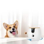 Furbo 360 pet camera tossing a treat toward a dog