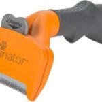 Orange medium FURminator short-hair dog undercoat deShedding tool, angled product view